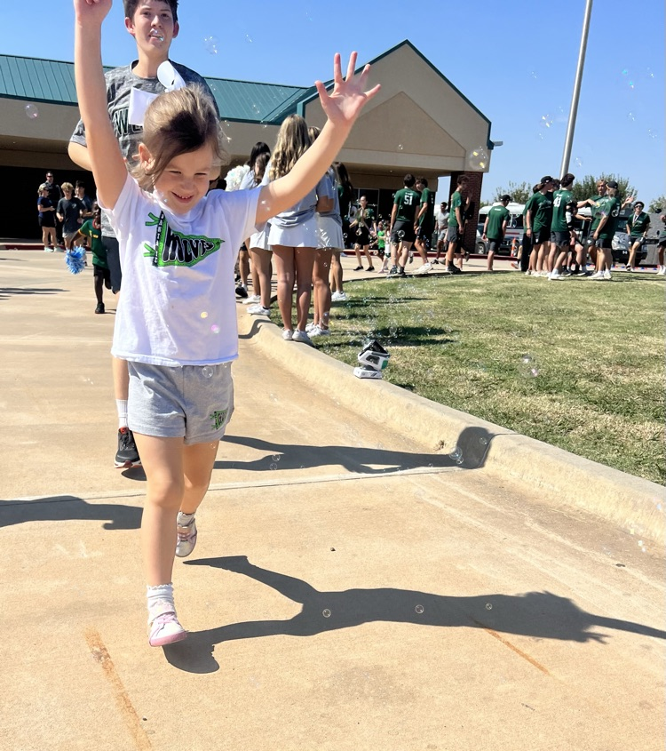 student running through bubbles
