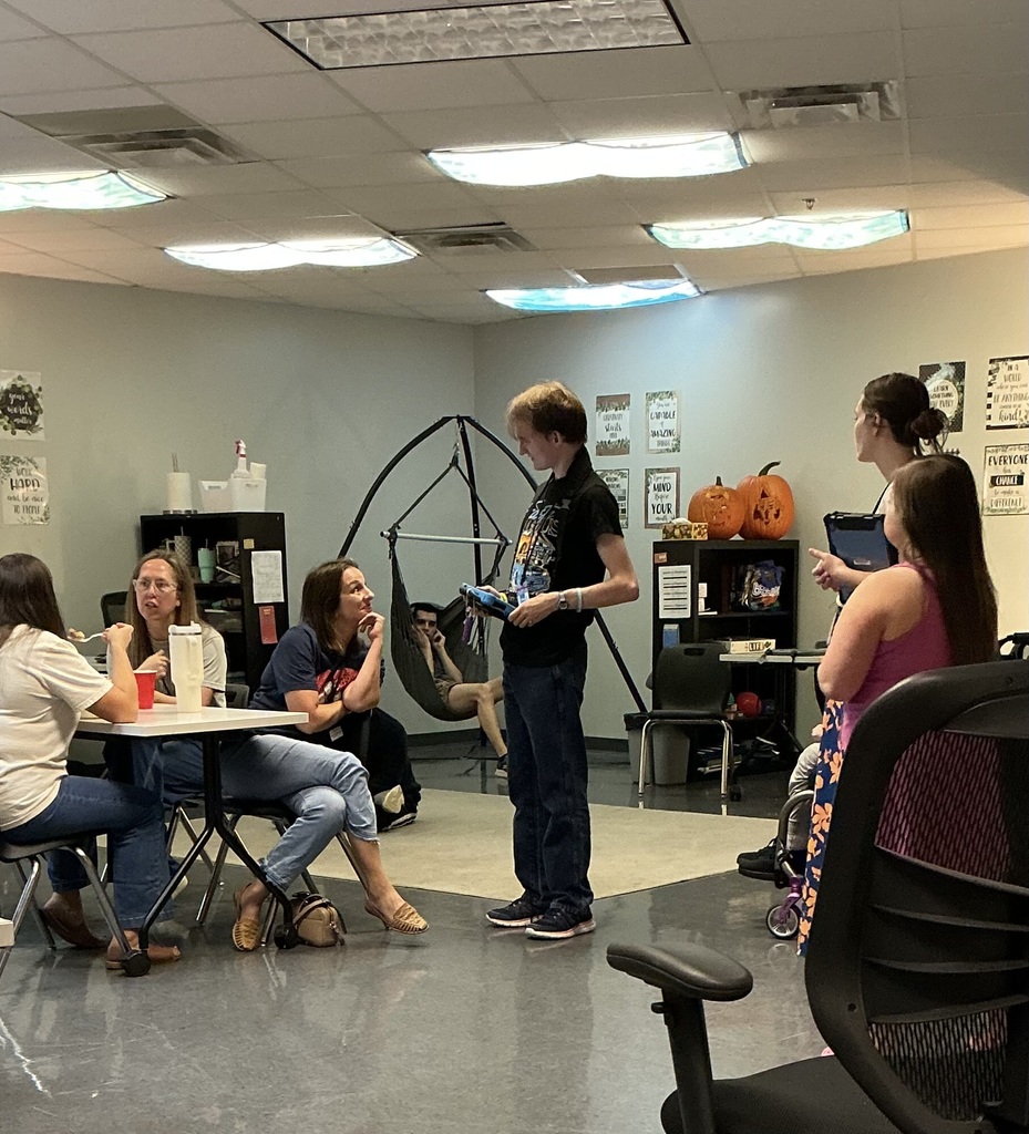 An intern  talking to a customer