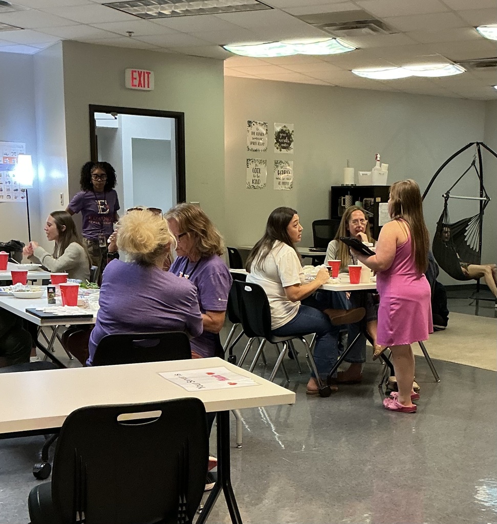 An intern/waitress taking a customers order