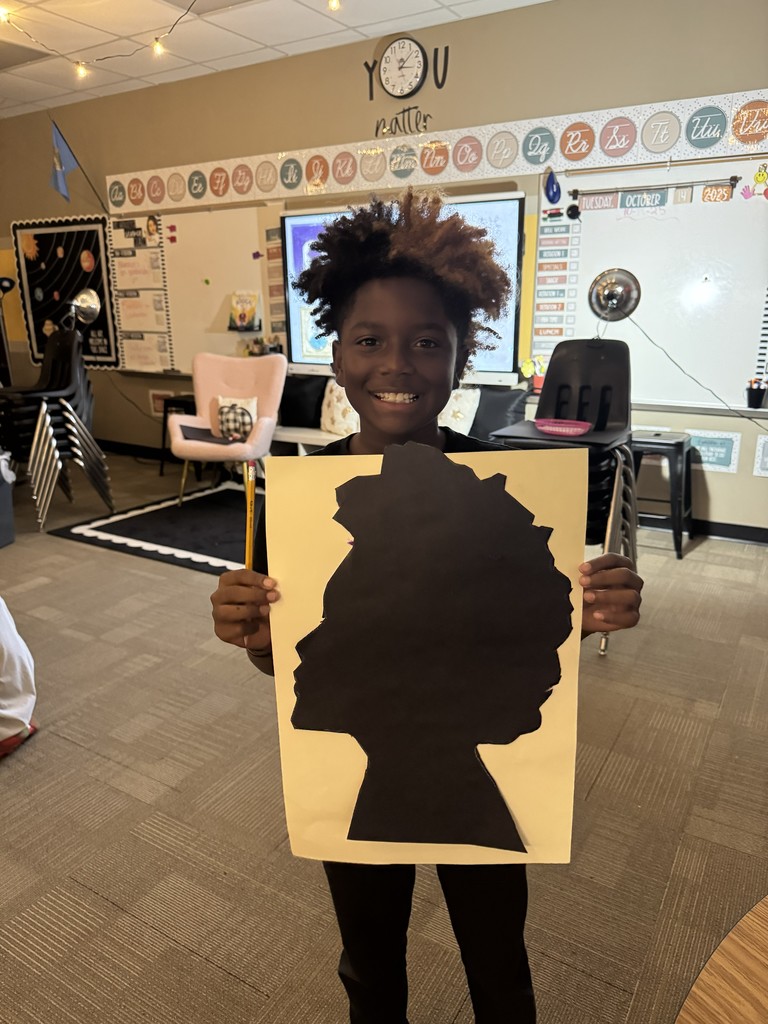student showing his silhouette picture