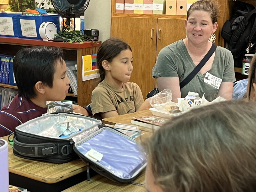 Fourth graders discussing a book