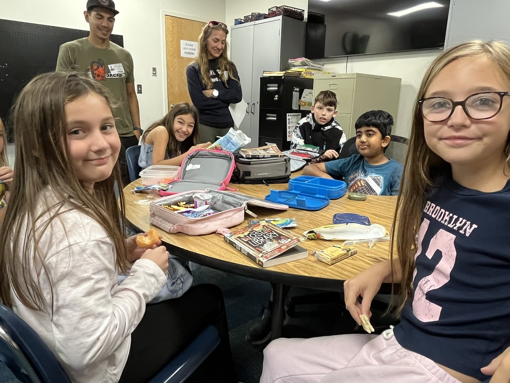 Fourth graders discussing a book