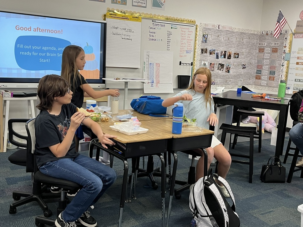 Fifth graders discussing a book