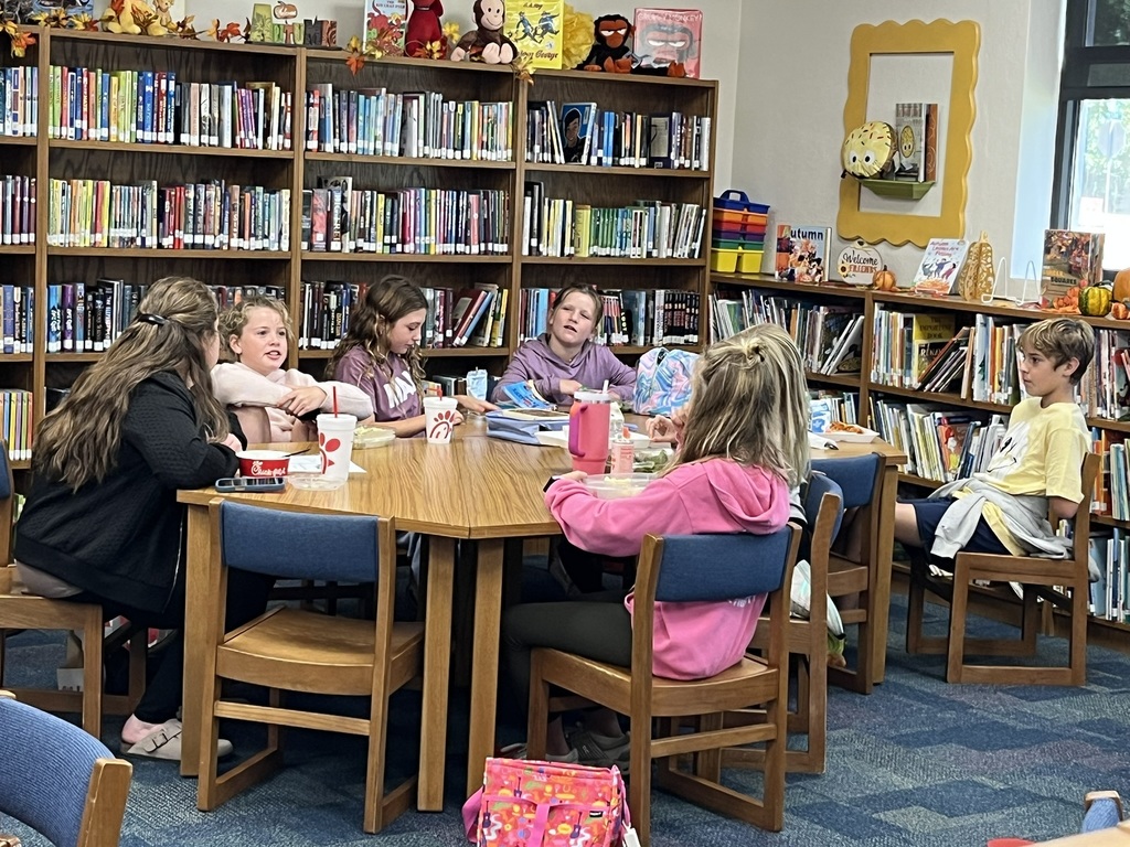 Fifth graders discussing a book
