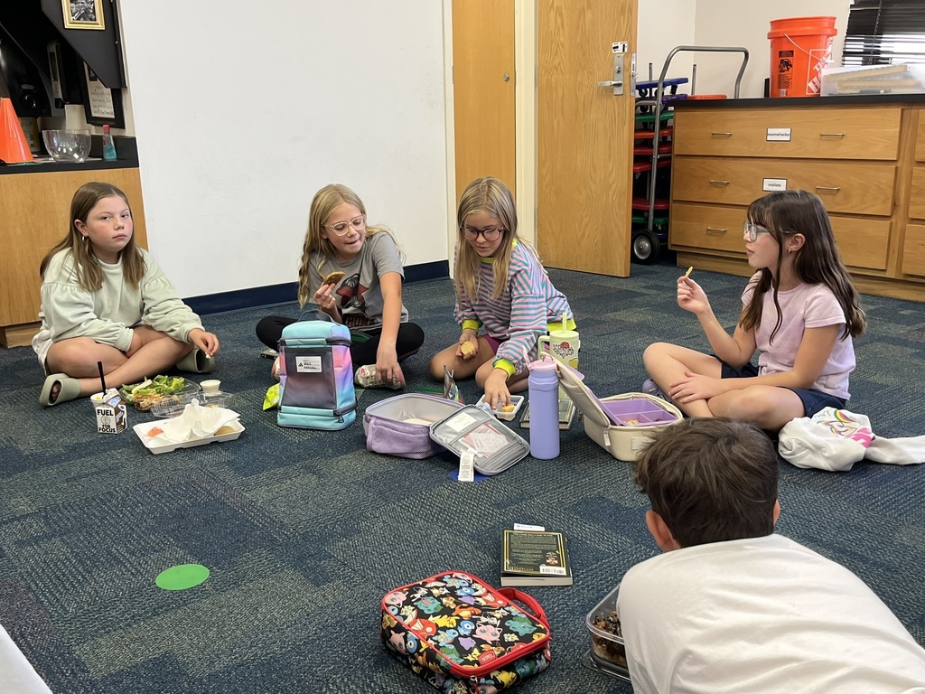 Fourth graders discussing a book