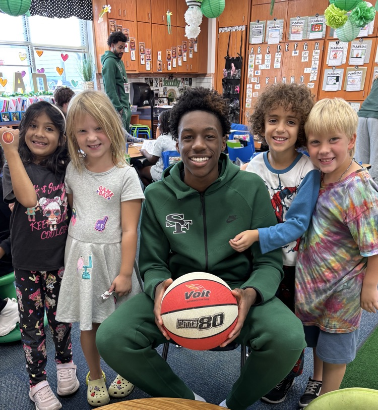 high school basketball player with first grade friends 