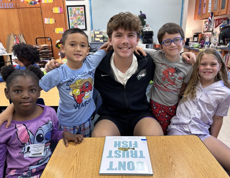 high school basketball player with first grade kids 