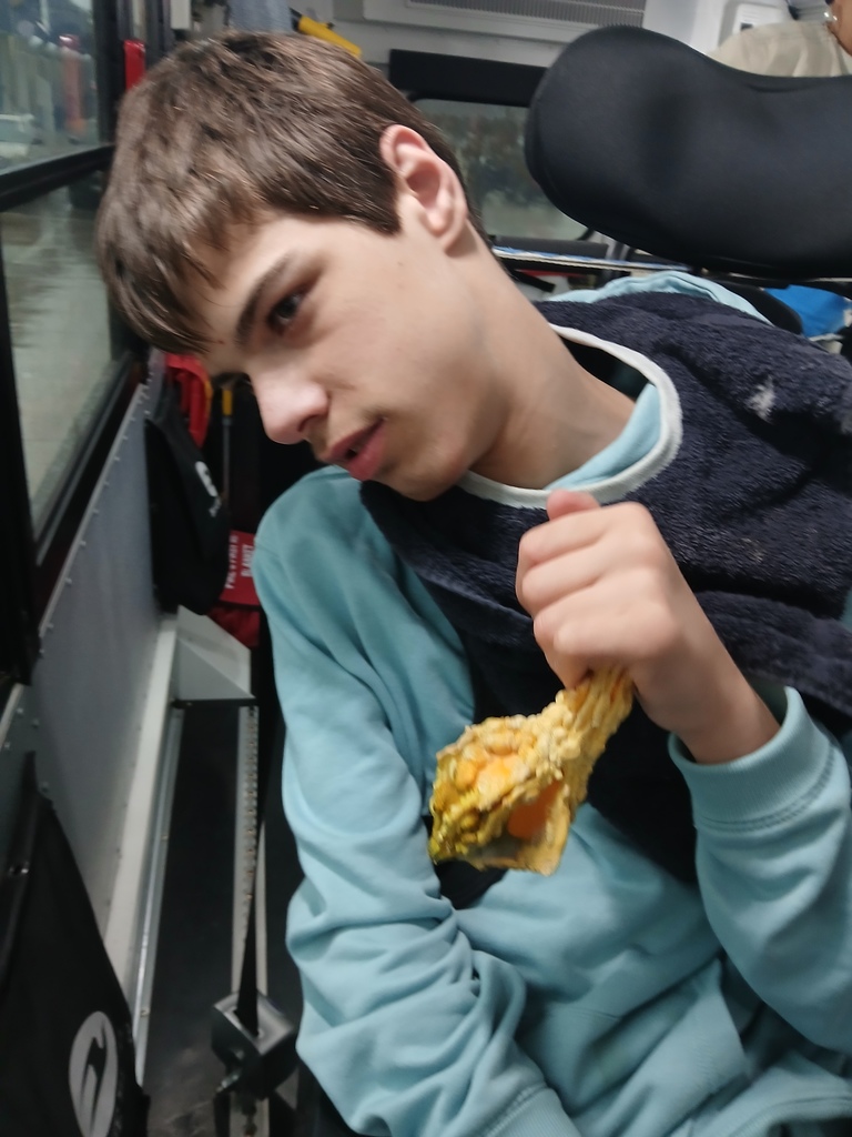 An intern holding a mini bumpy gourd