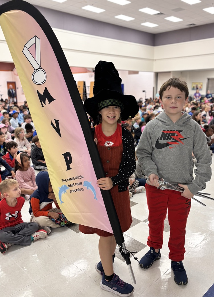 students holding mvp flag 