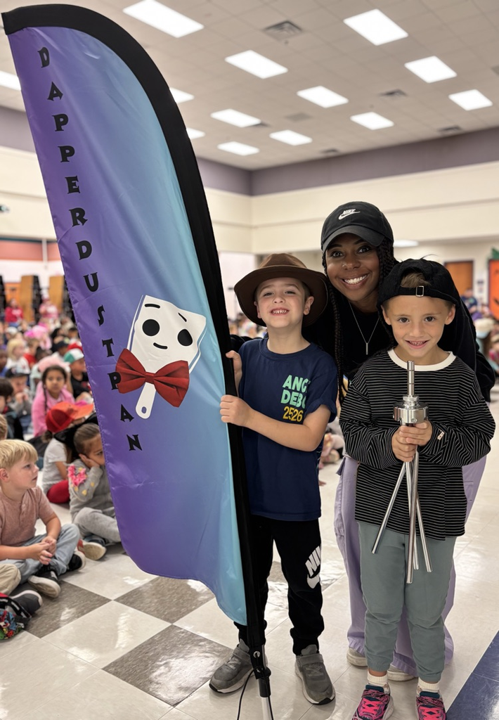 students holding dapper dustpan flag 