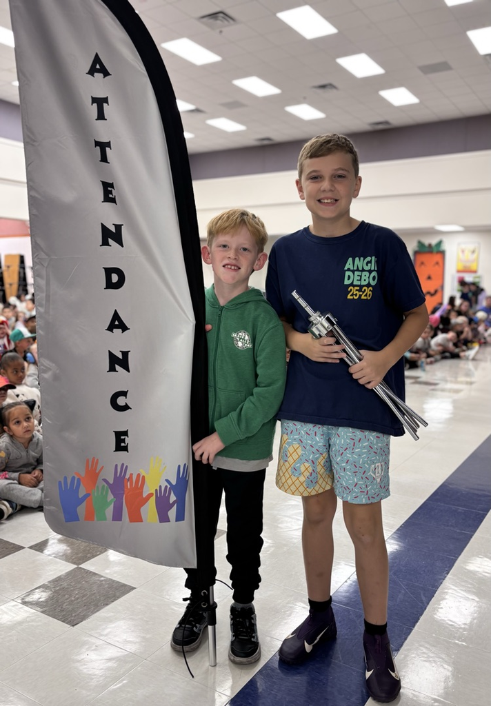 students holding attendance flag 