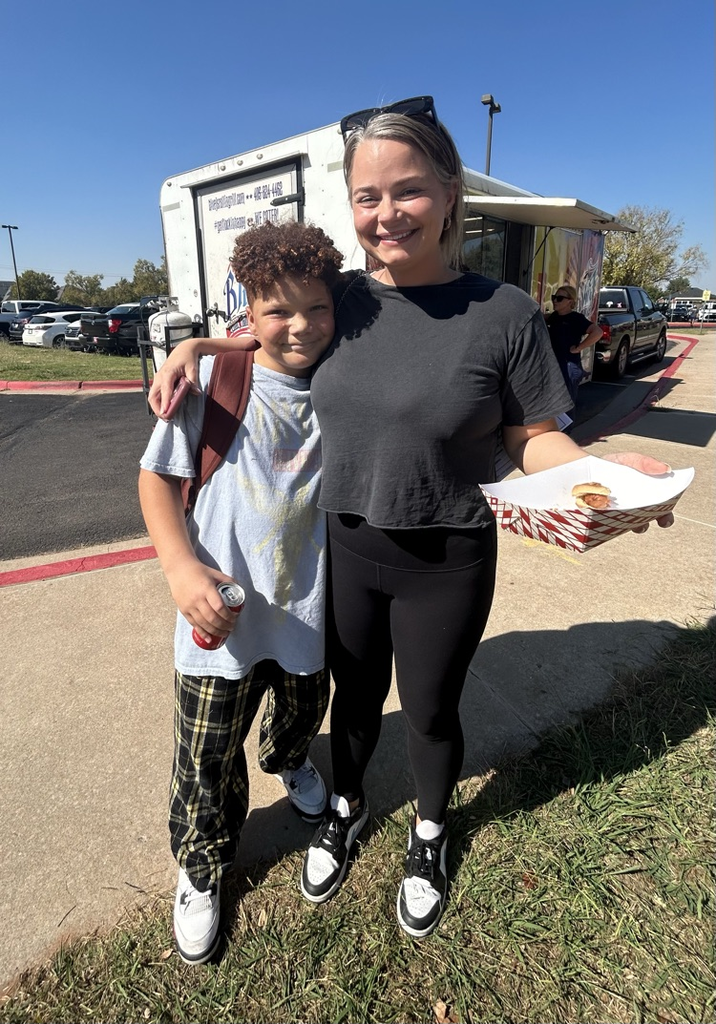student and parent at cookout 