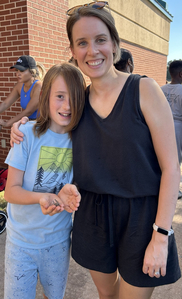 student with parent at cookout 