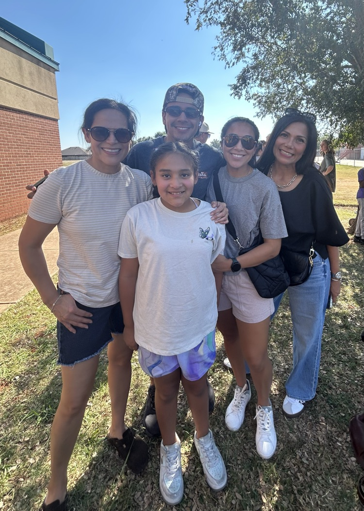 student with family at cookout 