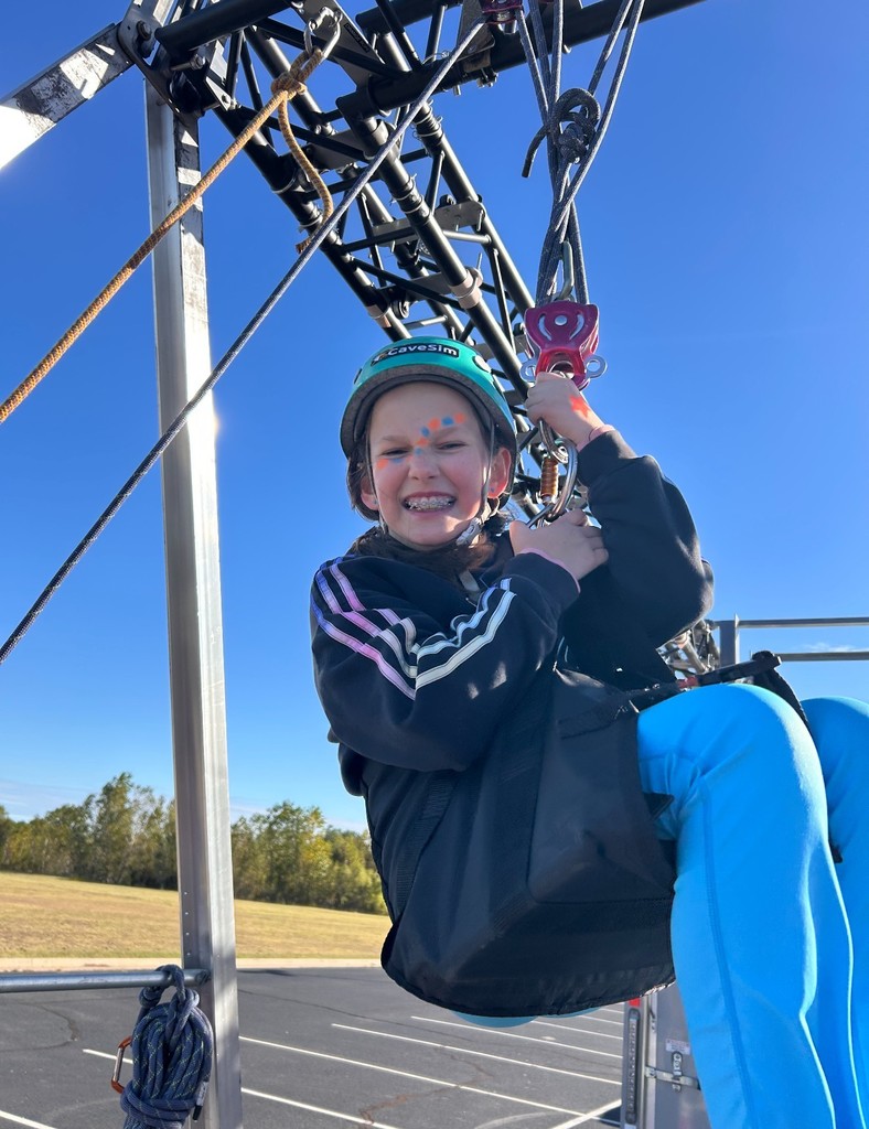 student in harness lifted off ground