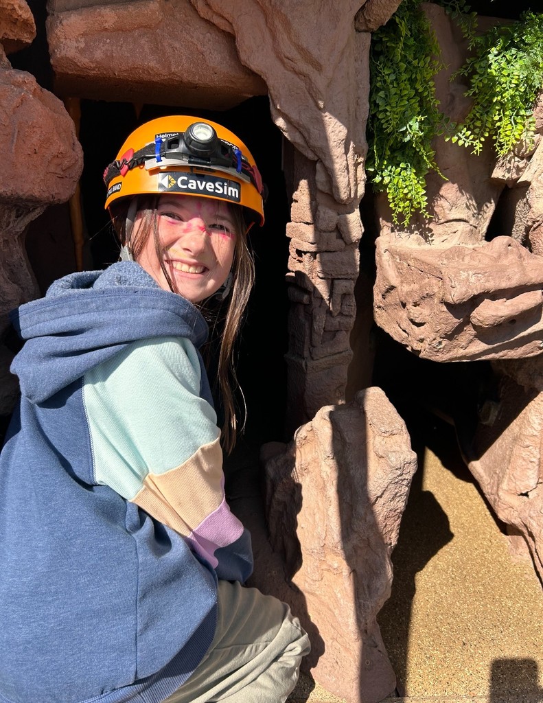 student in going in to cave simulator