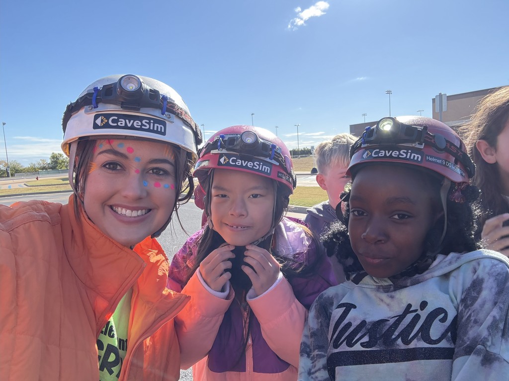 teacher and students with helmets on
