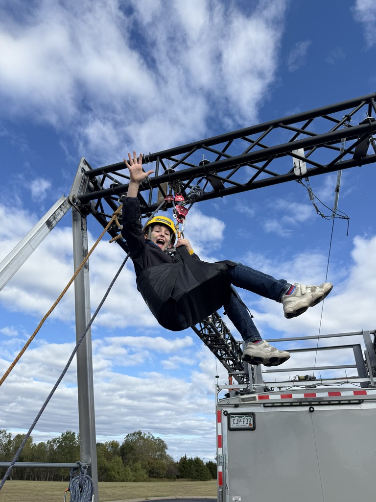student in harness lifted off ground