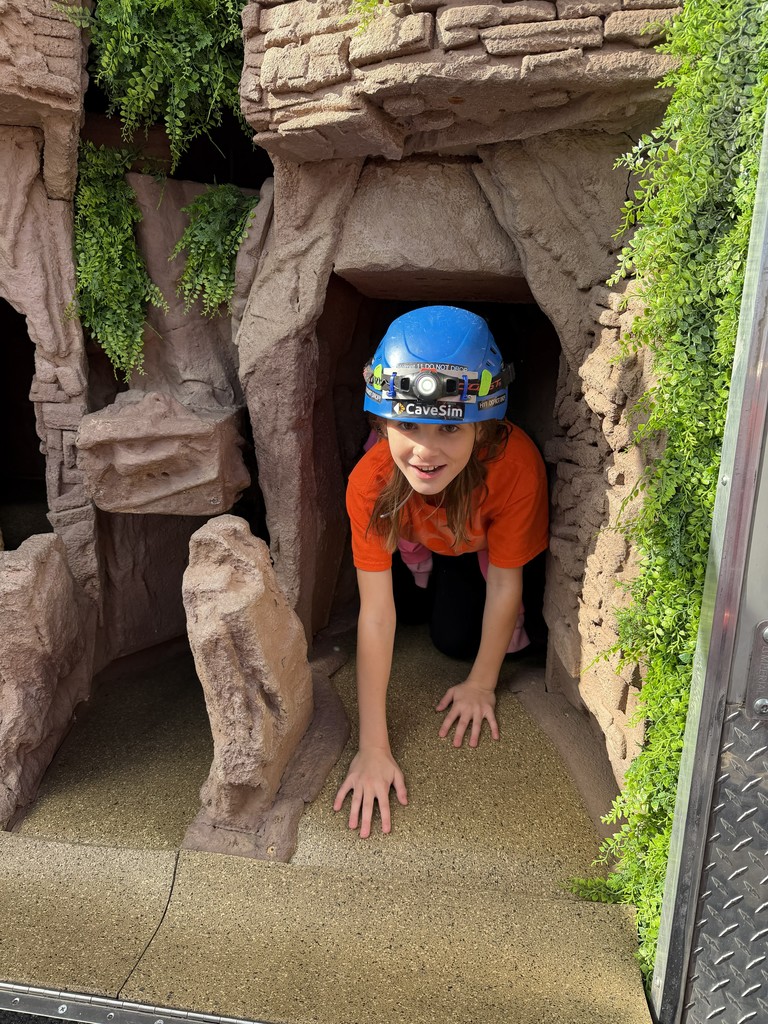 student in coming out of cave simulator