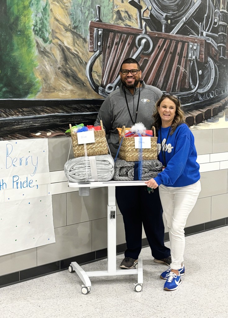 Mr. Berry and Mrs. Williams pose by their appreciation baskets for National Principals Month.