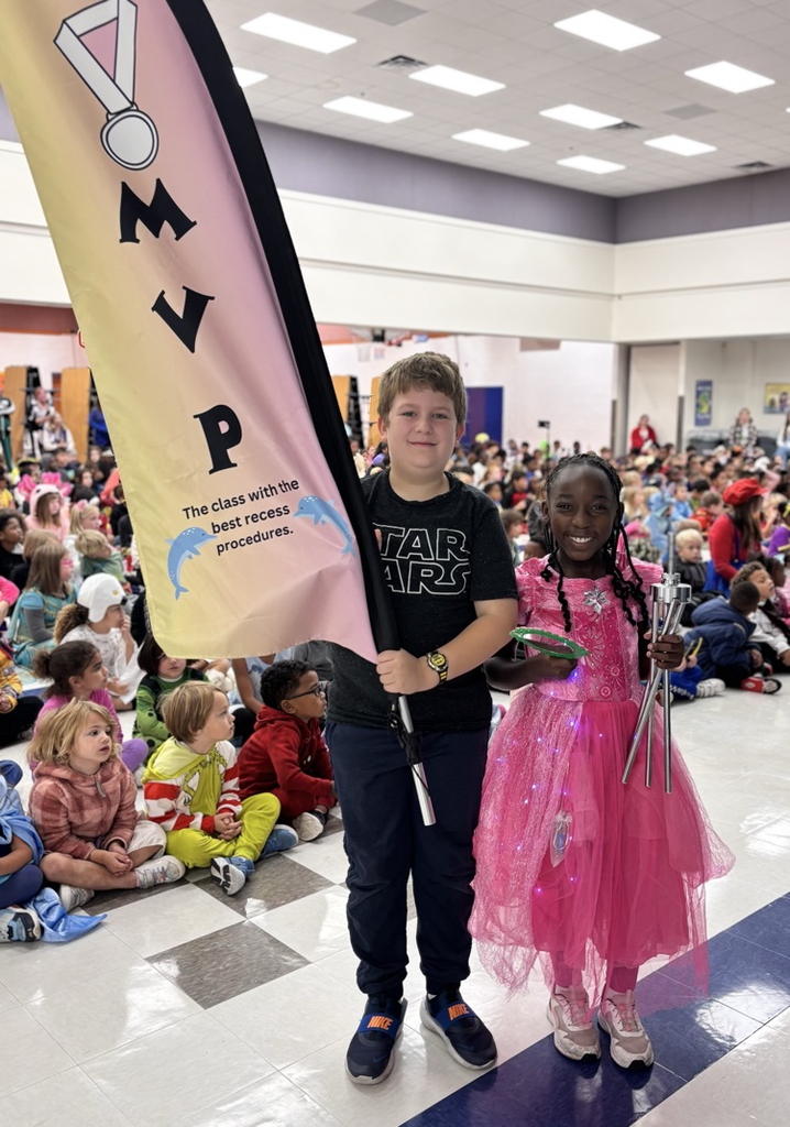 students holding mvp flag 