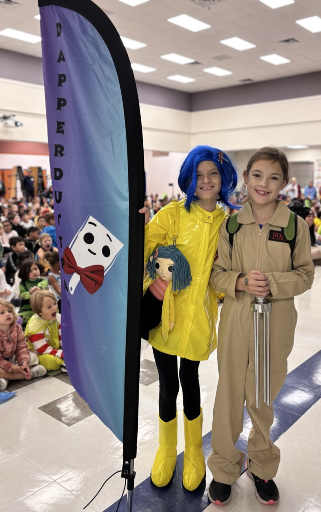 students holding dapper dustpan flag 