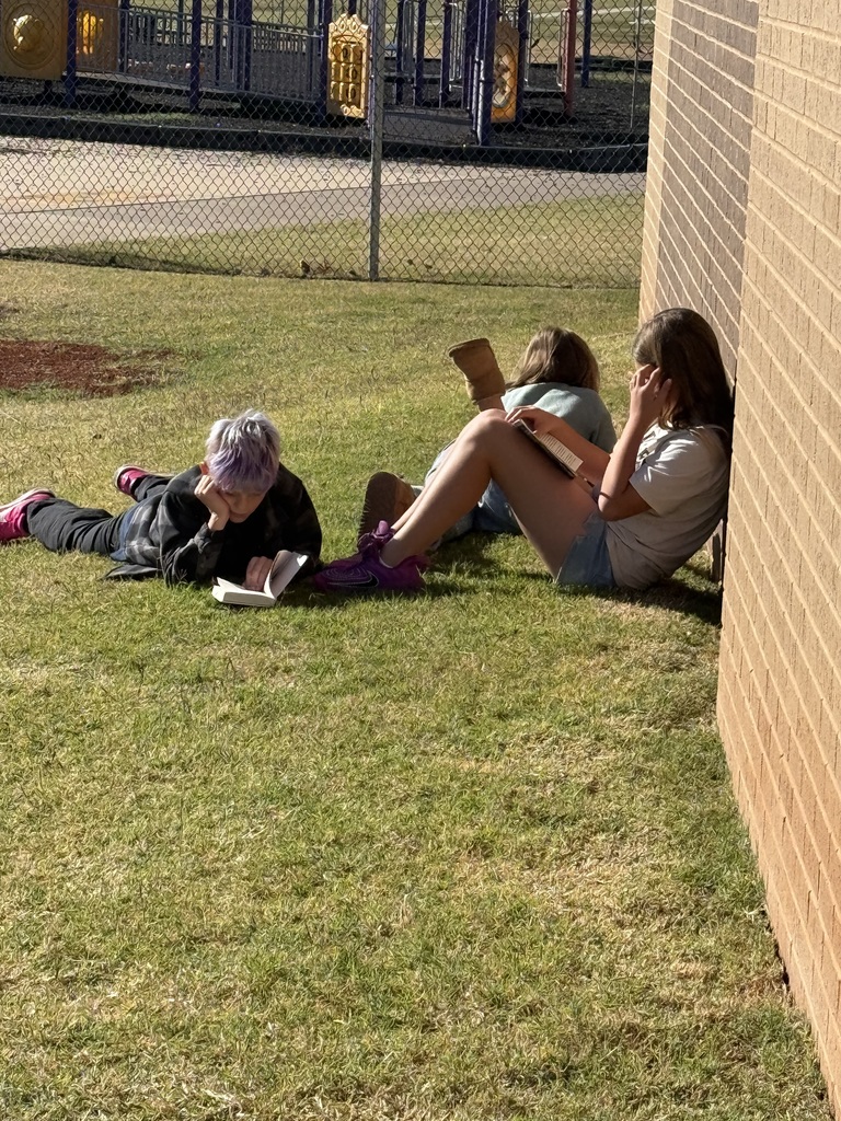 Students reading outside