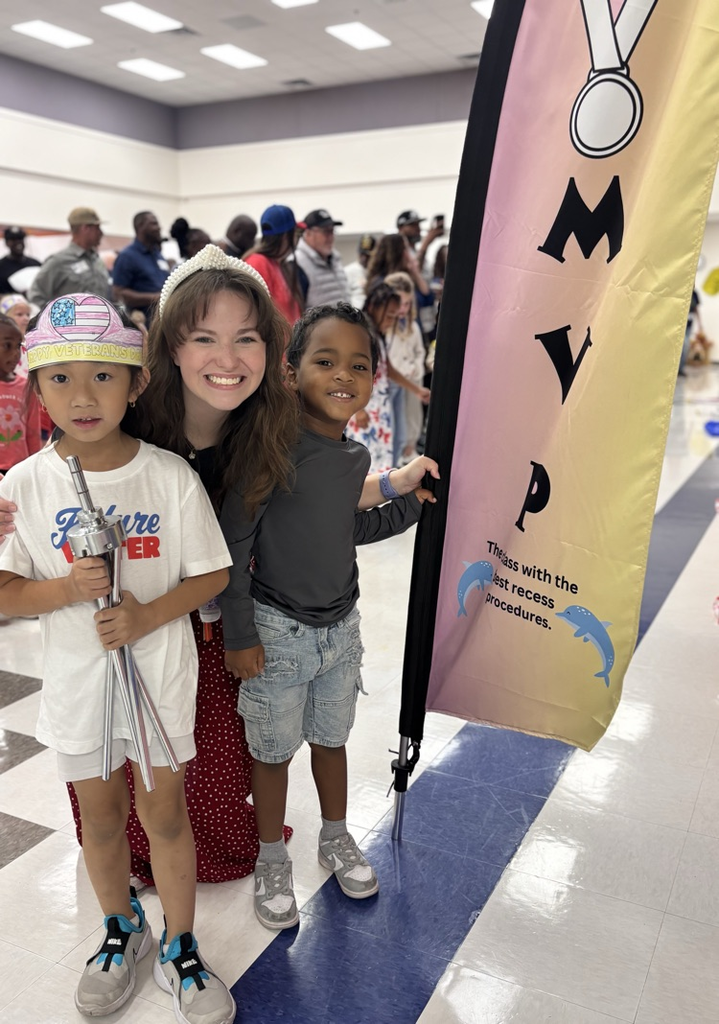 students holding mvp flag 