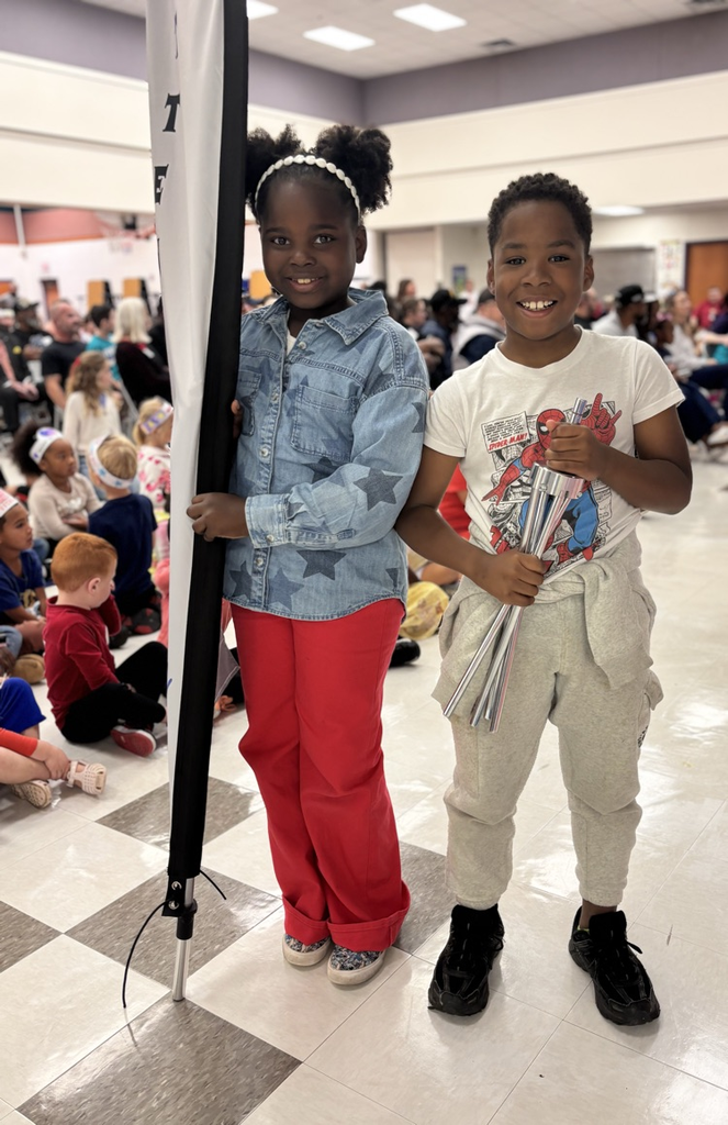 students holding attendance flag 