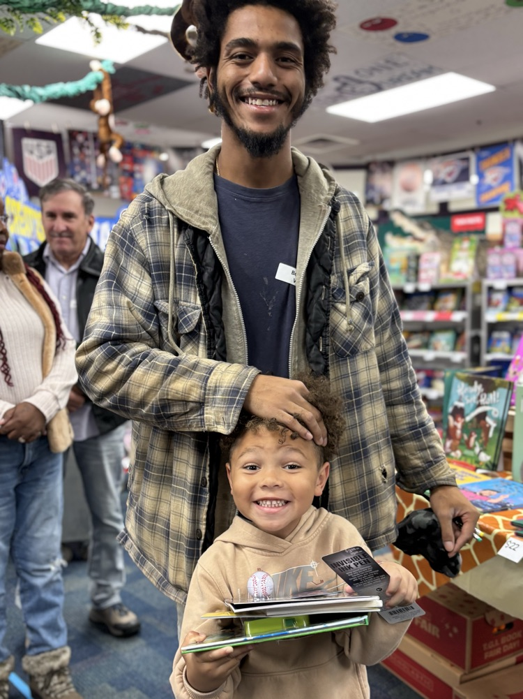 student and parent at the book fair 
