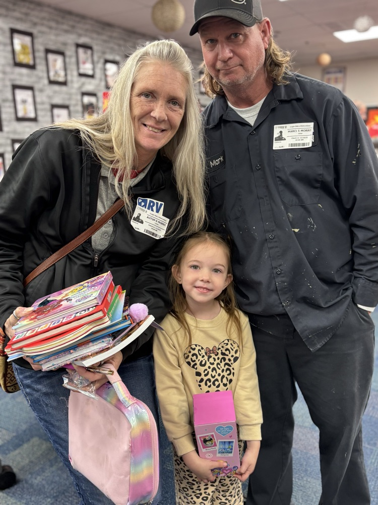 student and grandparents at the book fair 