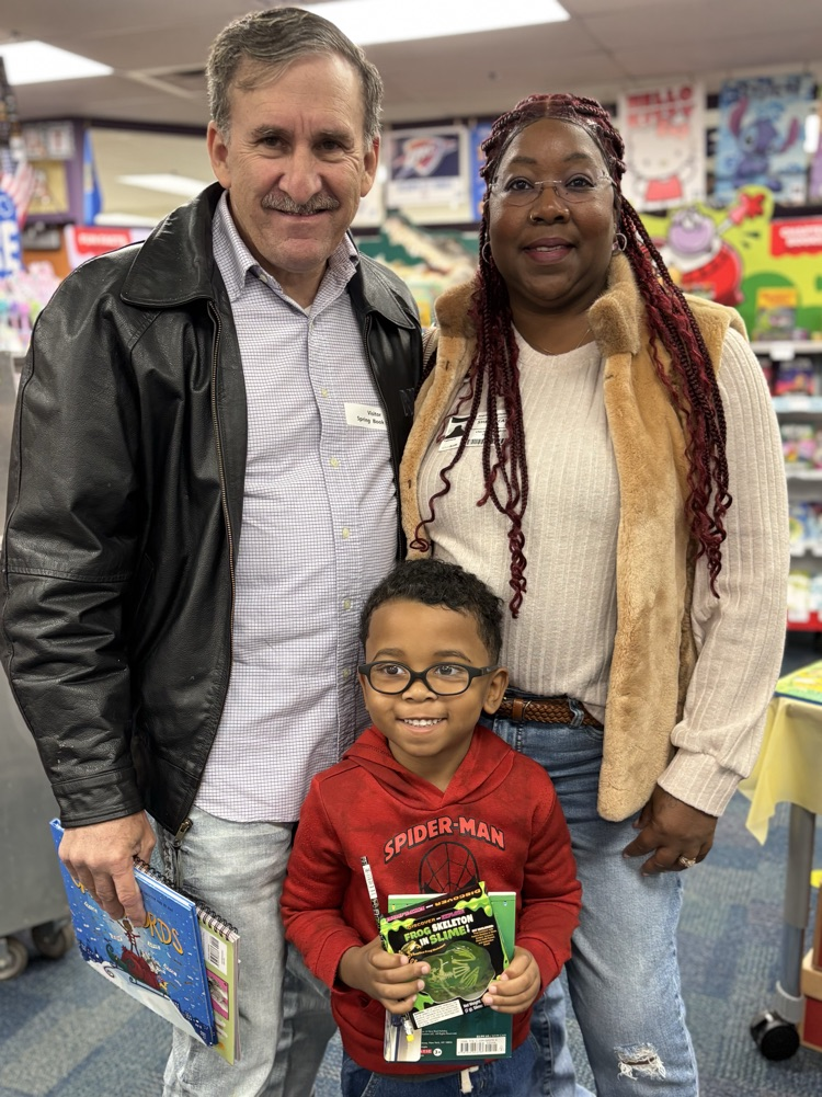 student and grandparents at the book fair 
