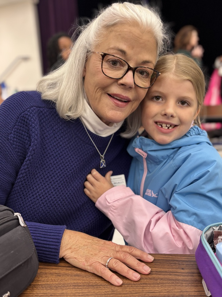 student and grandparent at lunch 