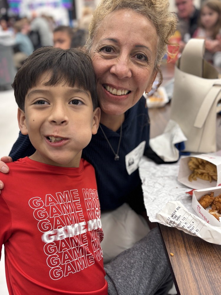 student and grandparent at lunch 