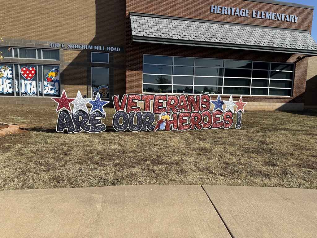 Sign in front lawn that says "Veterans are our heroes"
