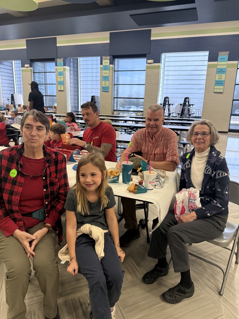 child smiling with her veterans