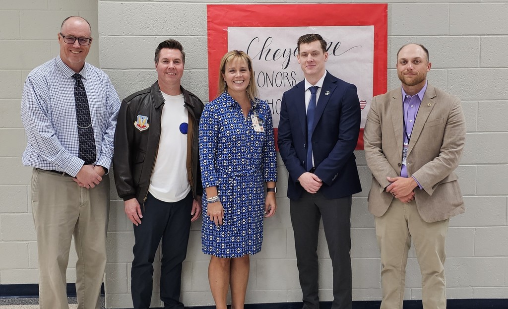 Mr. Wheeler, Senator Pugh, Mrs. Grinsteiner, Mr. Day, and Mr. Johnson posing for a picture