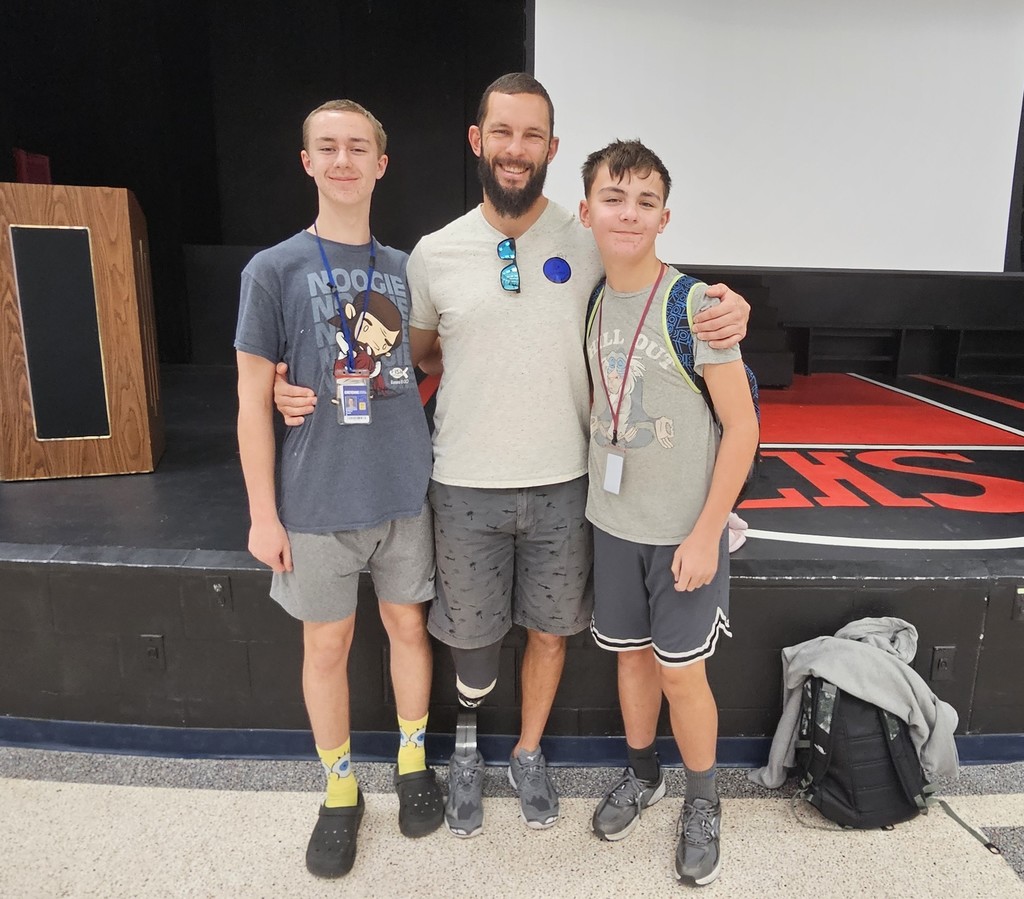 Military veteran, James Stuck, posing with his two sons