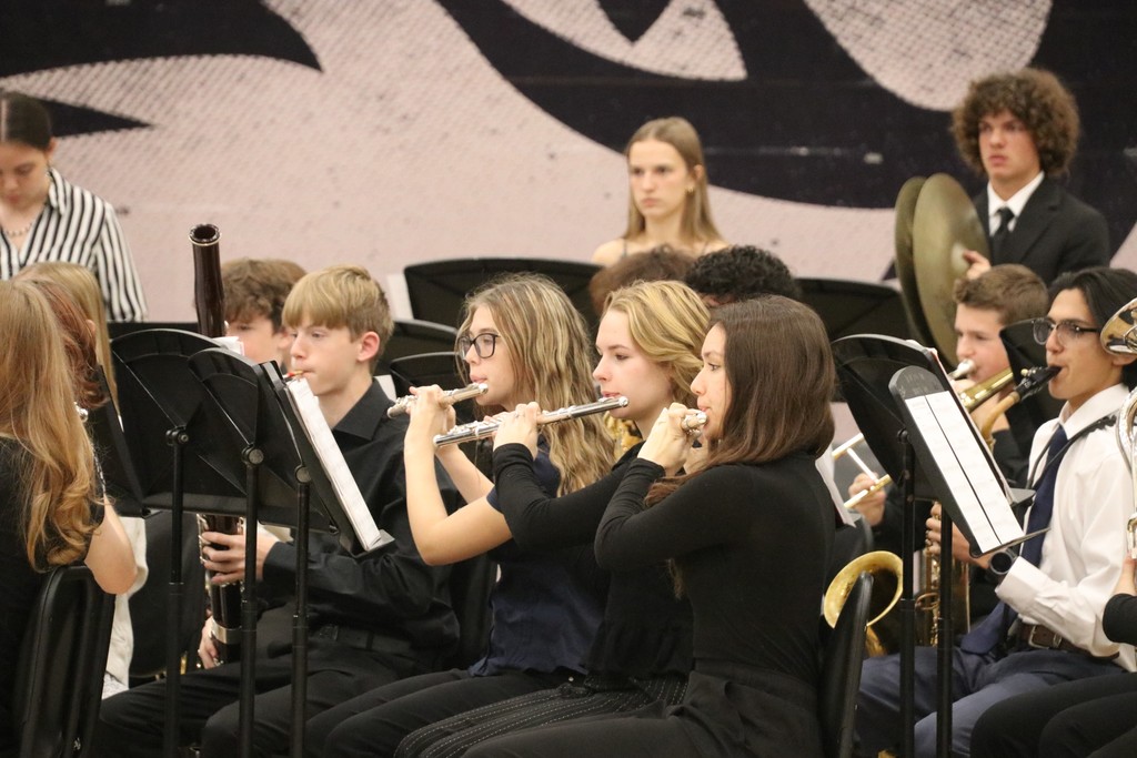 Band students performing at the assembly