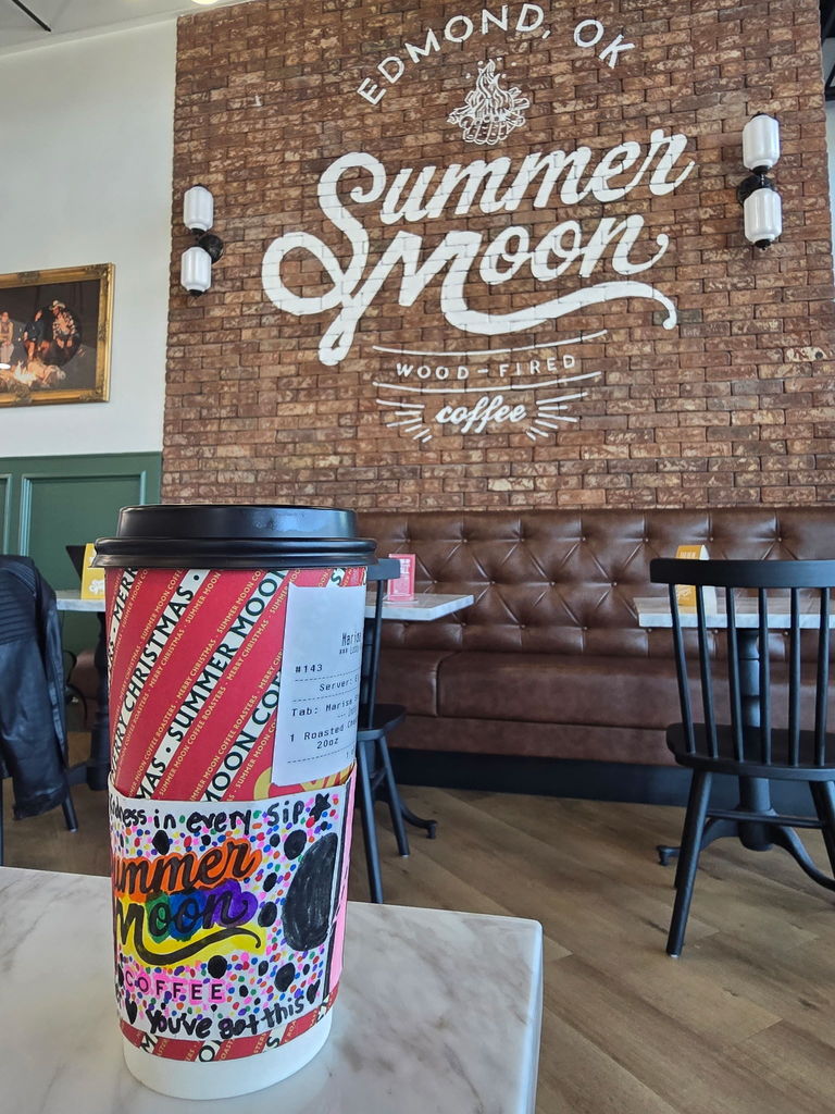 Coffee sleeve around coffee at Summer Moon