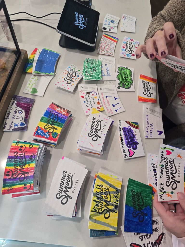 Many colorful coffee sleeves