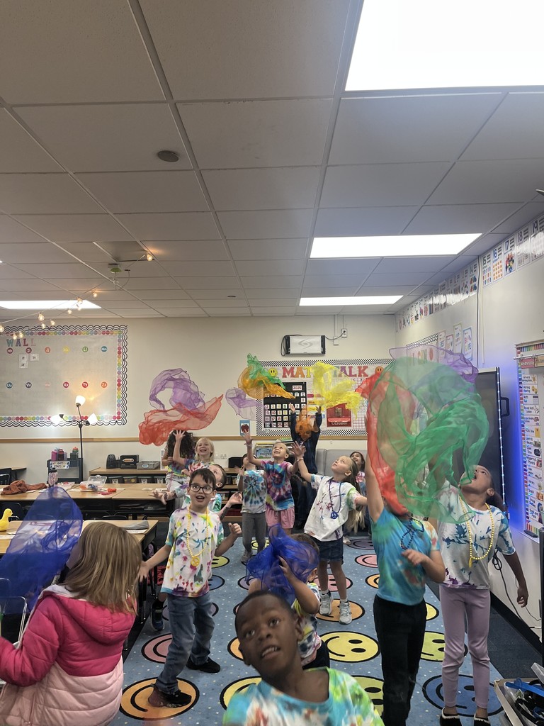 1st grade celebrating 60's day with tie die and dancing