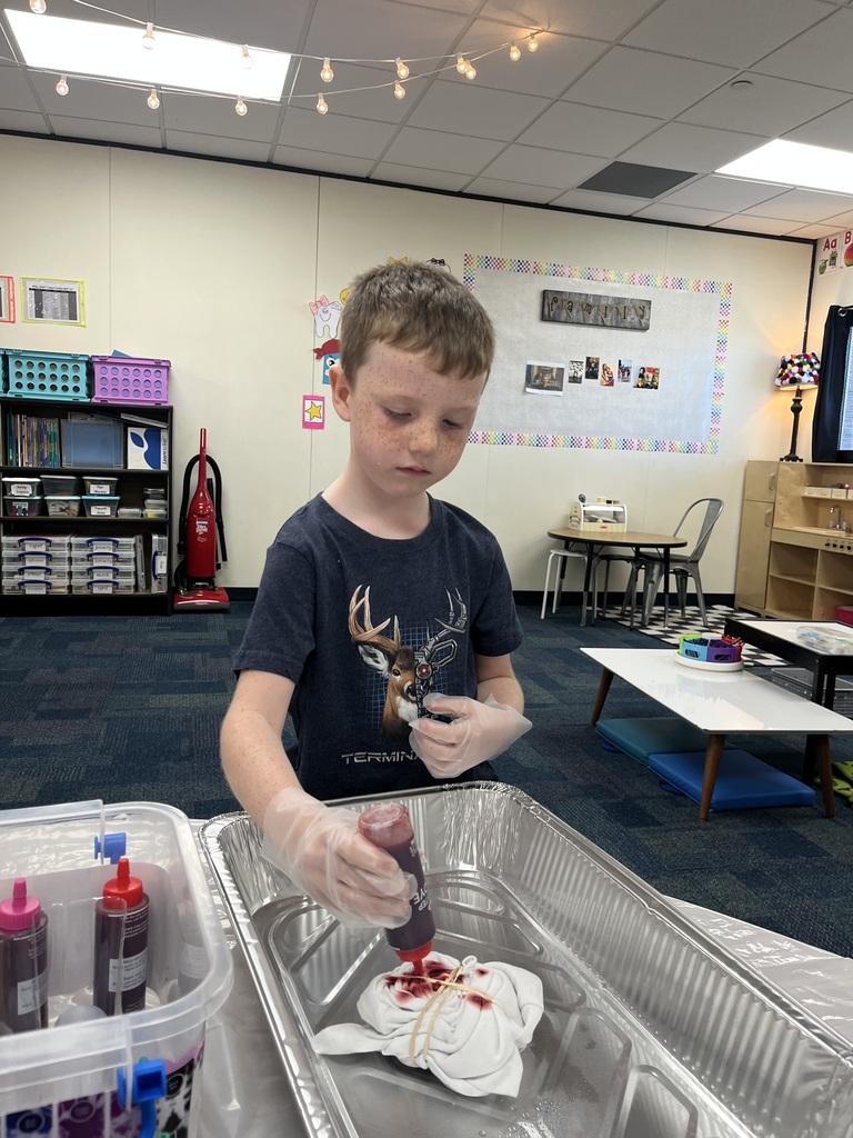 1st grade celebrating 60's day with tie die and dancing