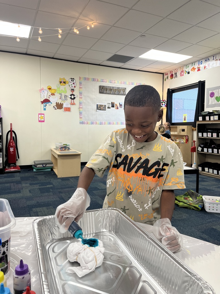 1st grade celebrating 60's day with tie die and dancing