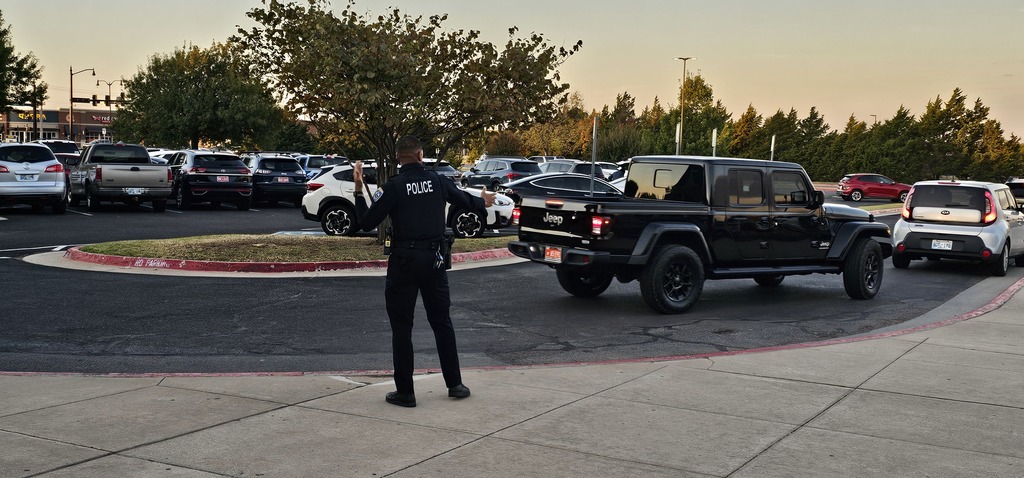 Officer Ross directing traffic during the morning car drop off line