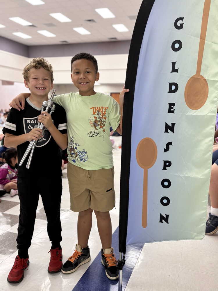 students with golden spoon flag 