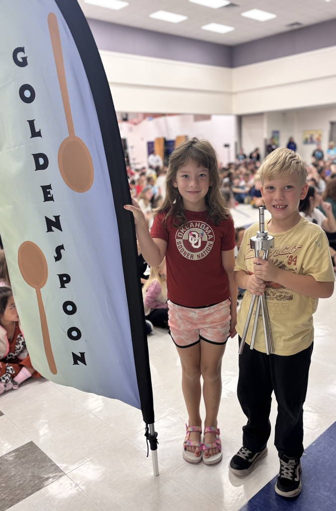 students with golden spoon flag 