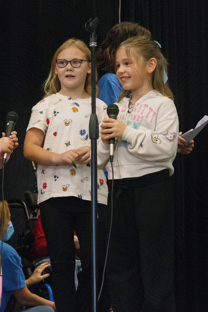 girls at a microphone