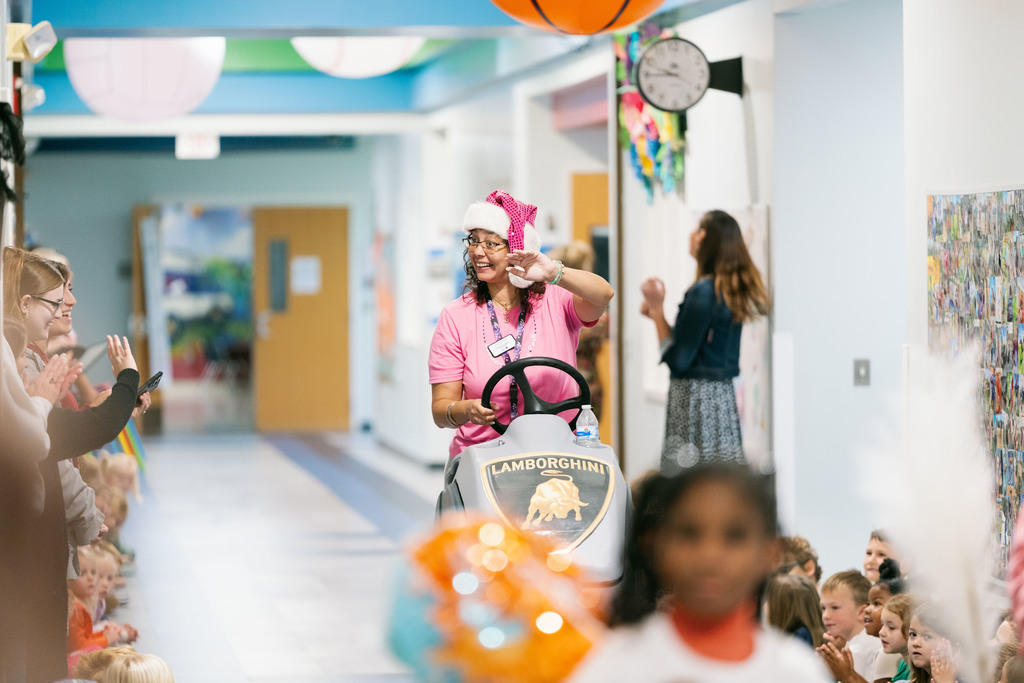 woman riding a floor cleaner