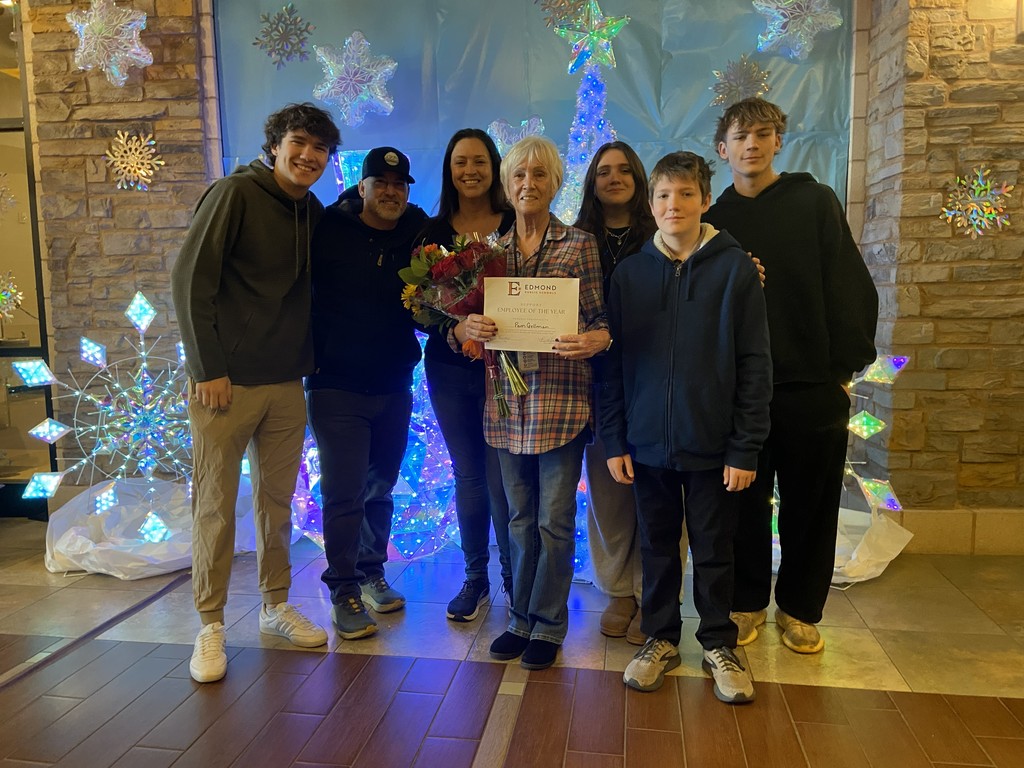 Pam, our SEOY, standing with family